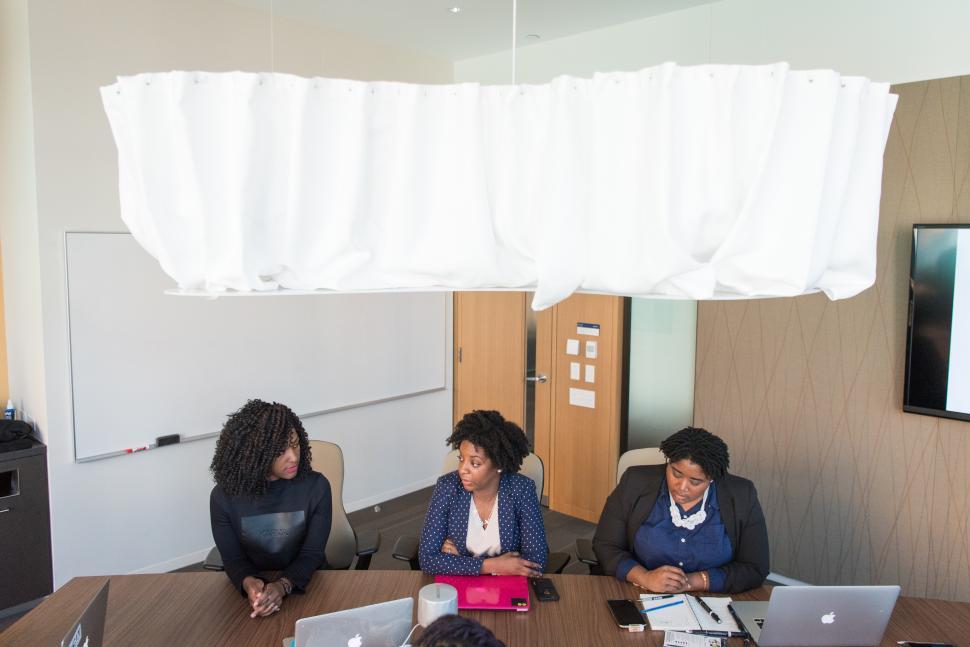 Free Image of Businesswomen working together in meeting room 