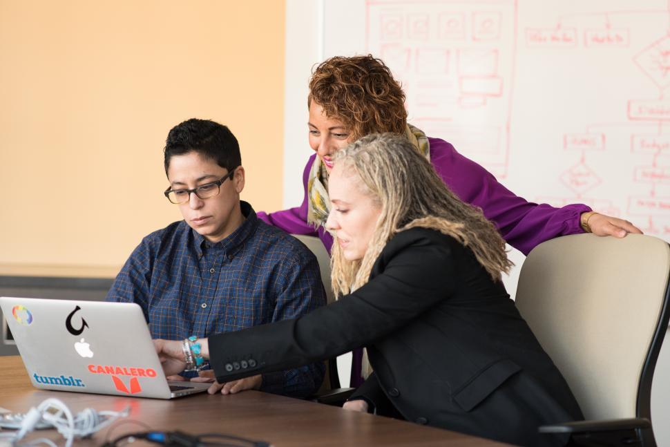 Free Image of Three Business People working together in meeting room 