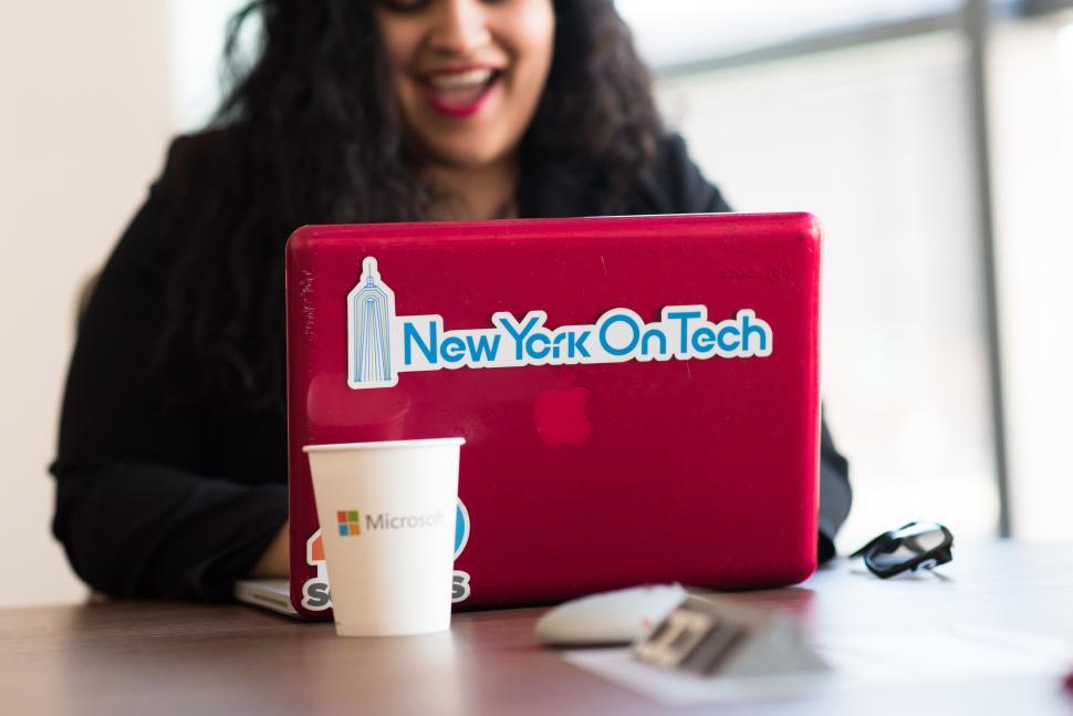 Free Image of Smiling female executive with laptop 