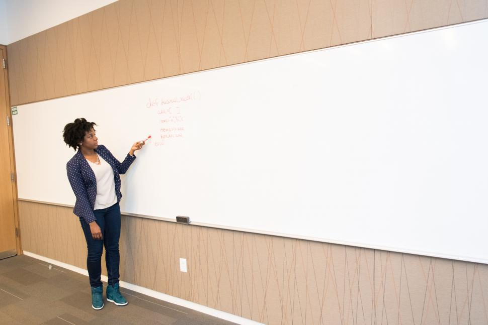 Free Image of Business woman with marker pen and whiteboard 