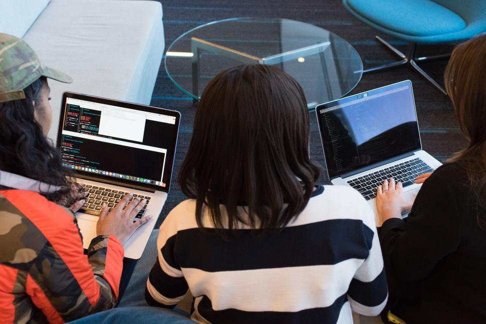 Free Image of Stylish female co-workers with laptops 