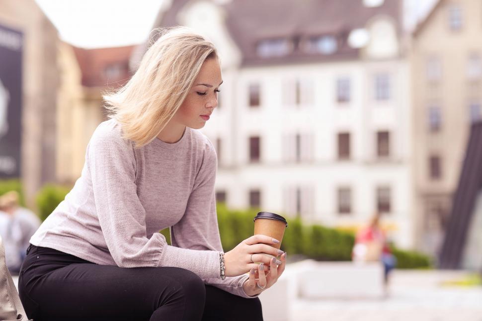 Free Stock Photo of Woman sitting alone outdoors