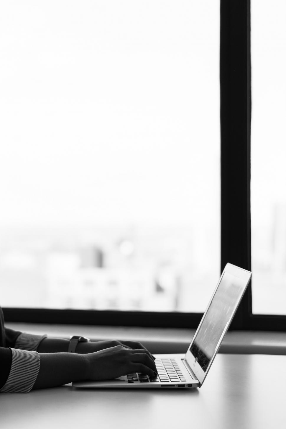 Free Image of Female hands typing on laptop keyboard - b&w 