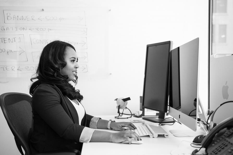 Free Stock Photo of Female executive working on computer in office