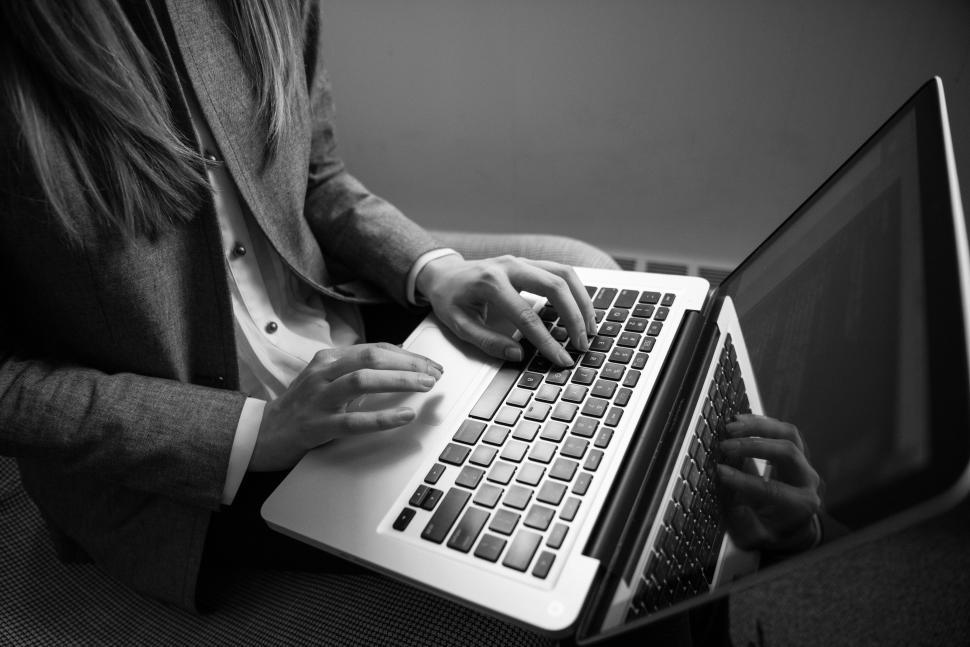 Free Image of Female hands typing on laptop keyboard 