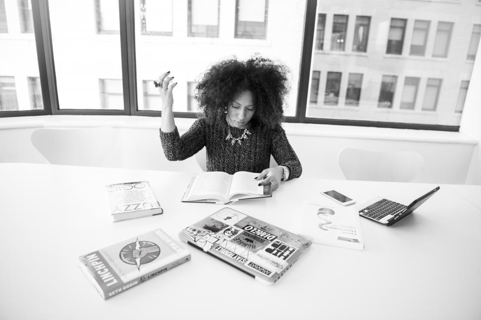 Free Image of Female developer with books - b&w 