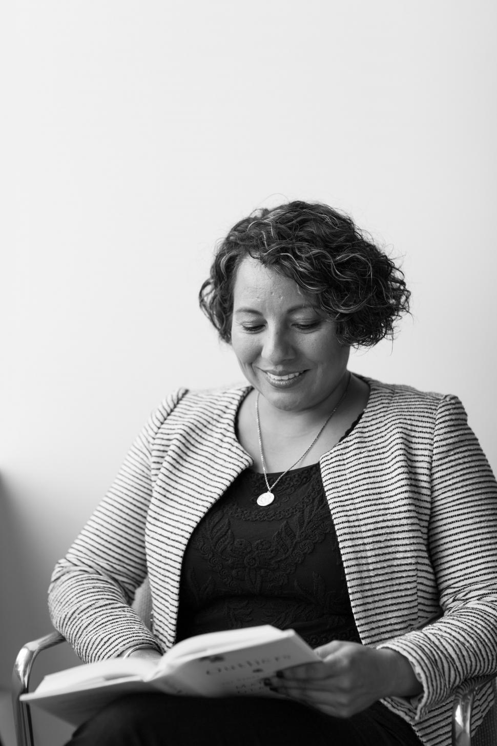 Free Image of Happy Businesswoman with book  - b&w 