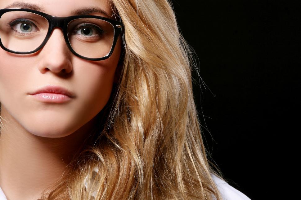 Free Image of young female student isolated on black 