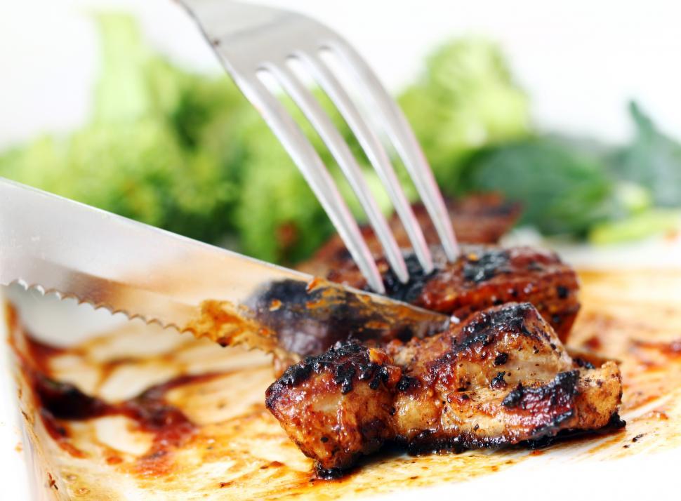 Free Image of Cutting fresh, tasty steak 