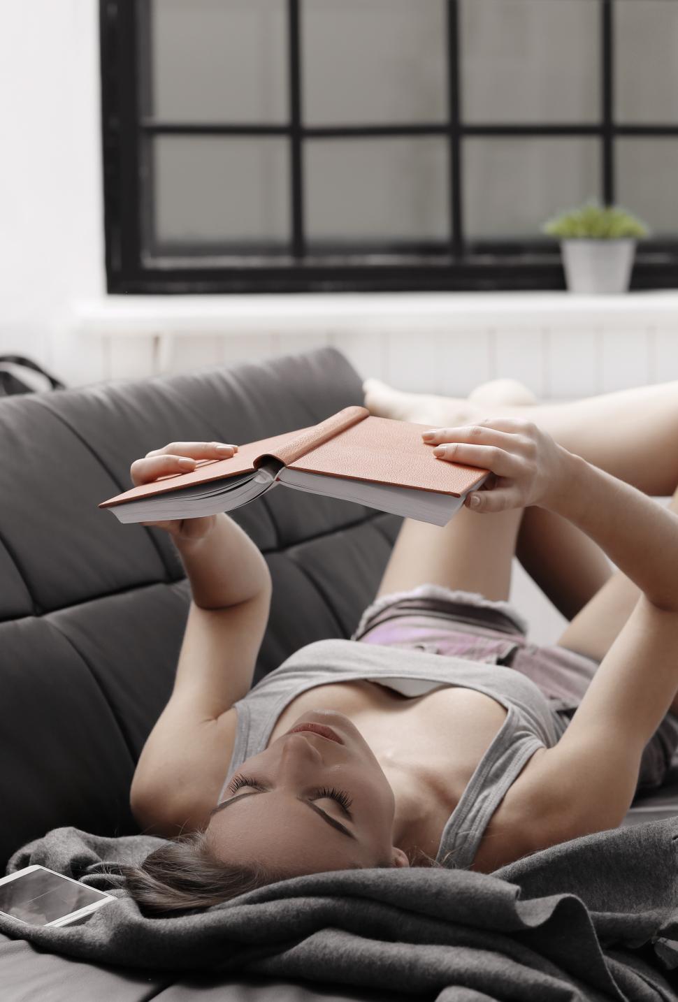 Free Image of Young woman reading a book 