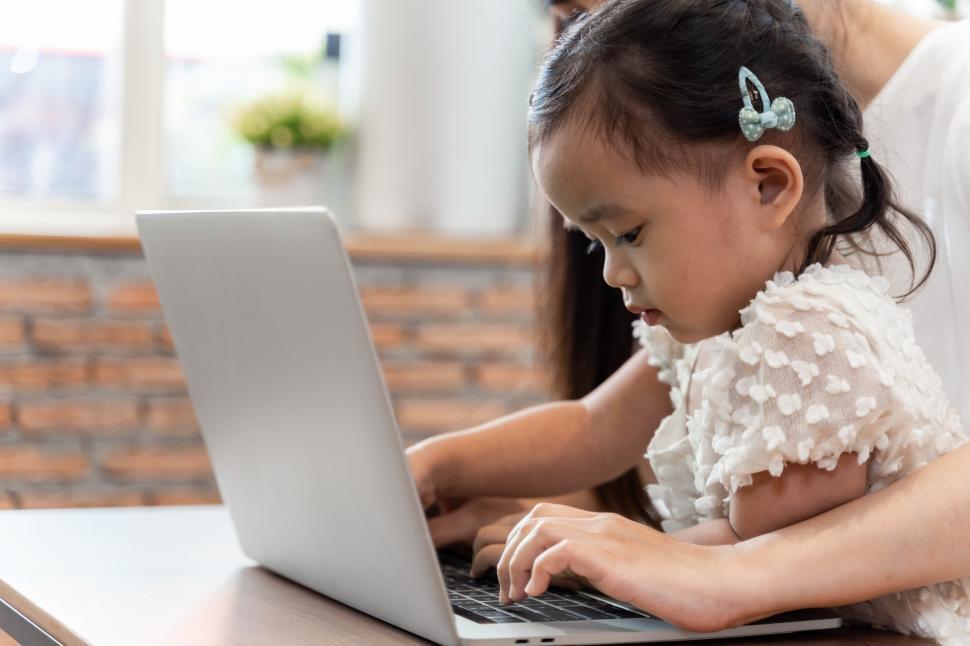 work-from-home-concept.-mother-and-daughter-using-a-computer.jpg