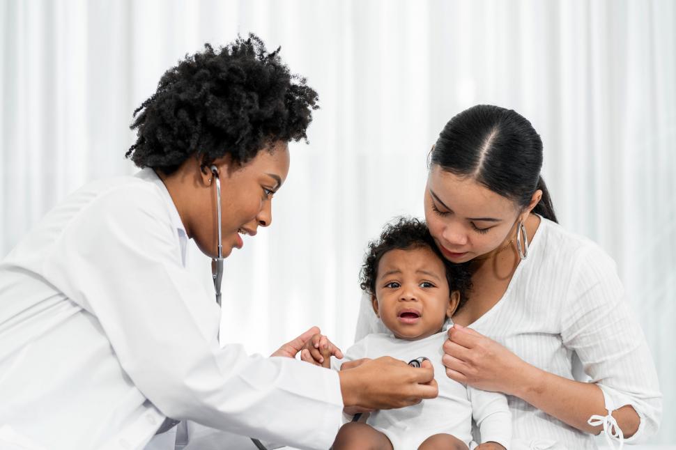 Free Stock Photo of African female pediatrician hold stethoscope to examine  baby boy