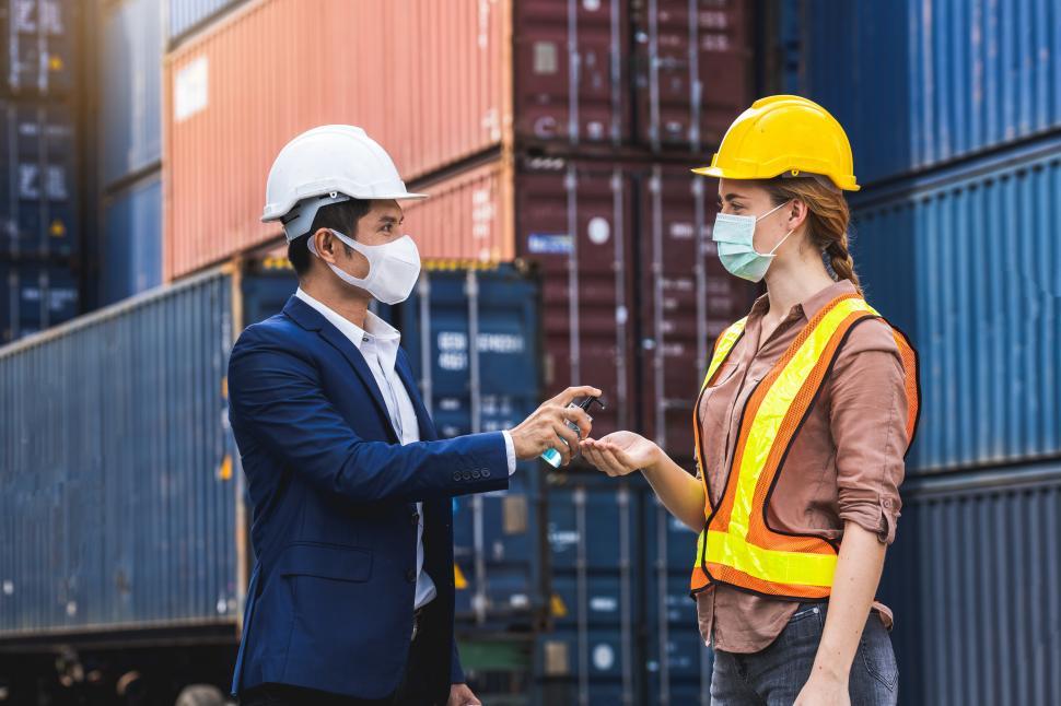 Free Image of Workers sanitizing hands 