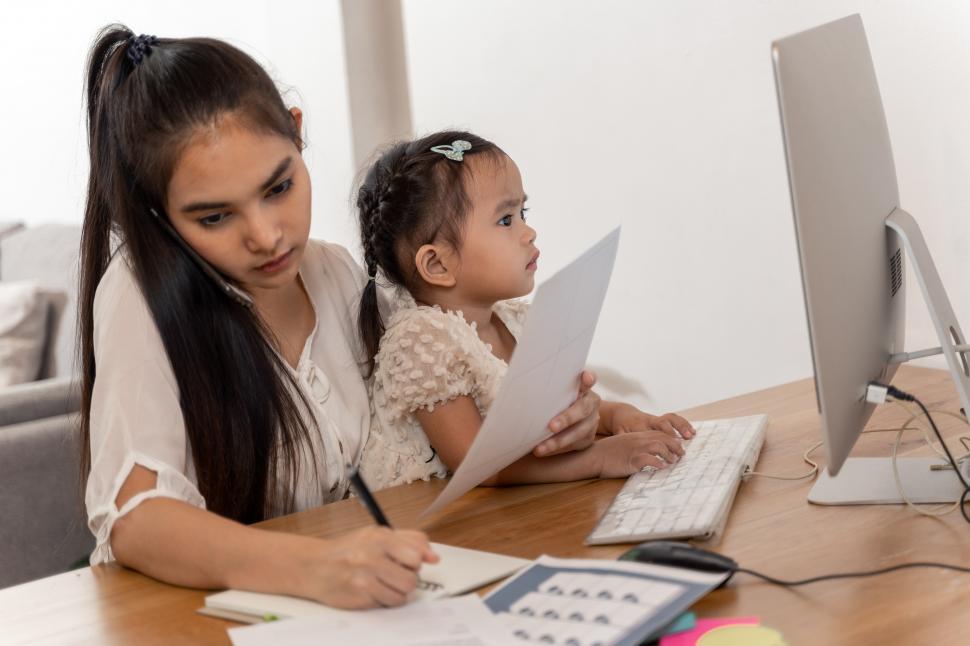 Free Stock Photo of Mother and daughter using a computer, work from