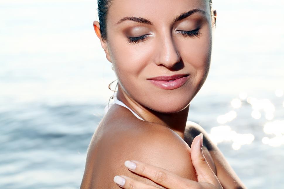 Free Image of Beautiful young woman in the beach 