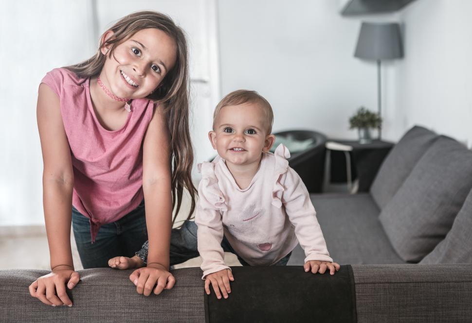 Free Image of Sisters on the couch at home 