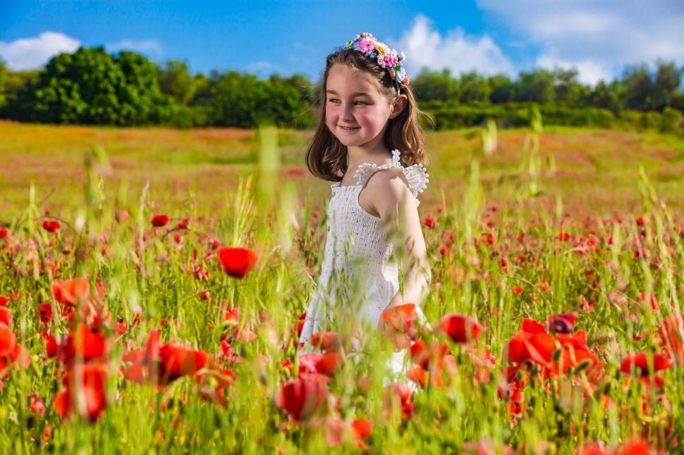 Free Image of Happy girl in flower field in summer 