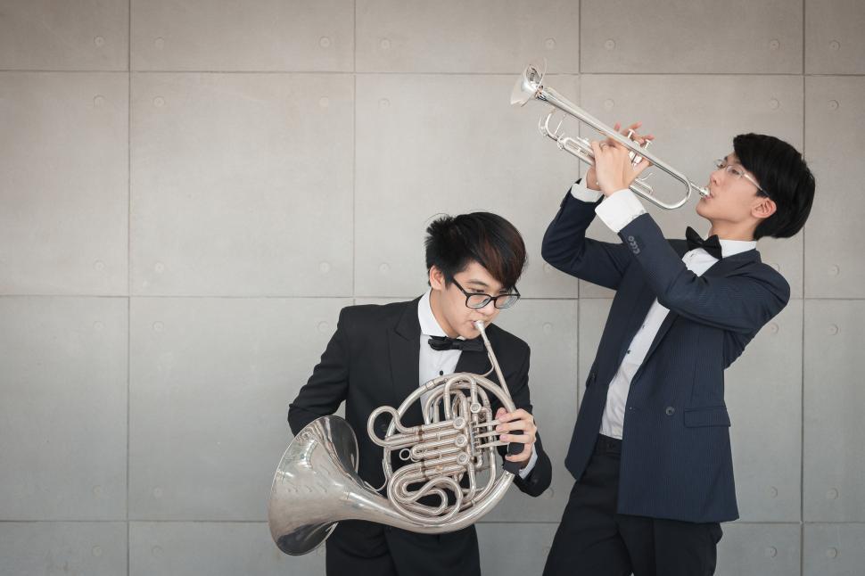 Free Stock Photo of Musicians playing the trumpet and French horn