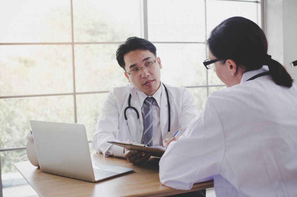 Free Stock Photo of Doctors are discussing the symptoms of the patient ...