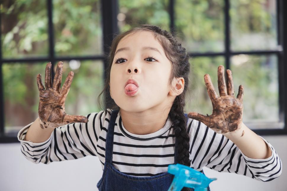 free-stock-photo-of-muddy-kid-being-sassy-sticking-out-tongue