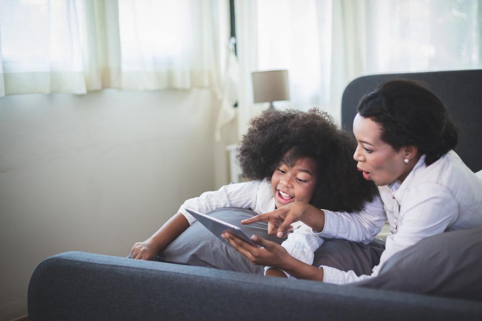 Free Image of Mother is teaching daughter with tablet computer device 