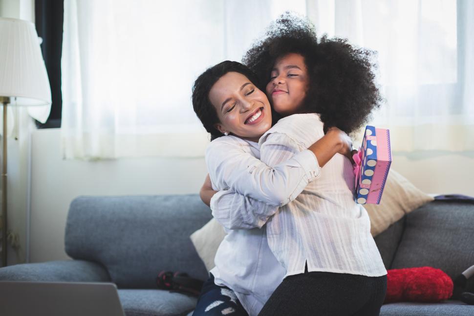 Free Image of  Mother and girl smiling and hugging 