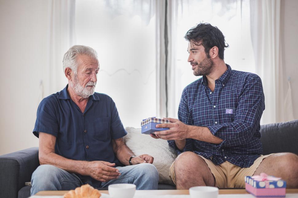 Free Image of Father s day concept - Son hold a gift box to give to the father 