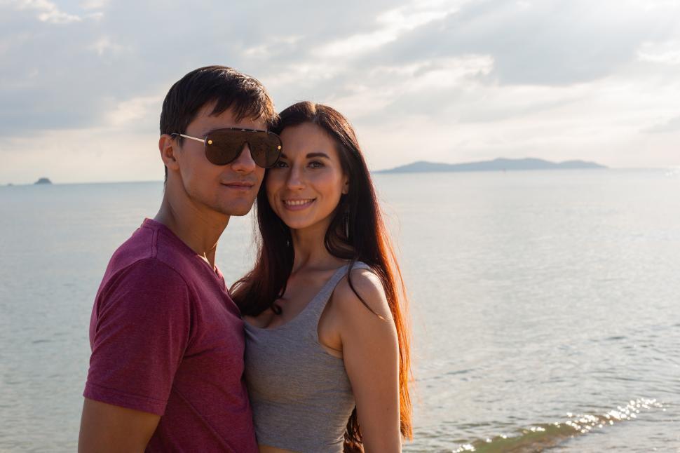 Free Image of Portrait of couple in casual style at the beach 