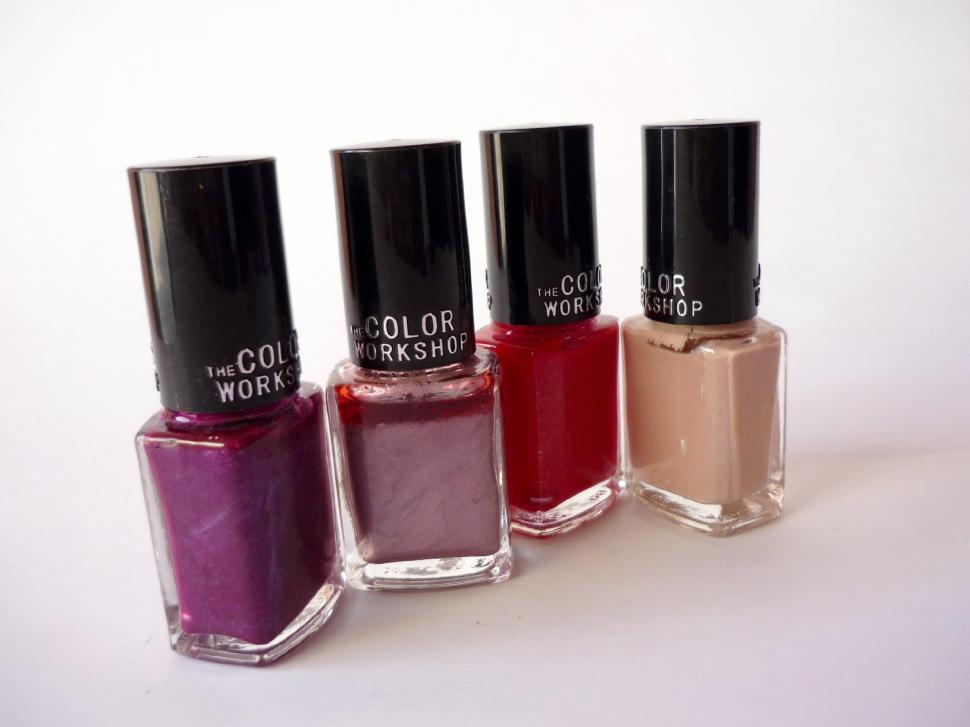 Free Image of Three Bottles of Nail Polish Arranged Together 