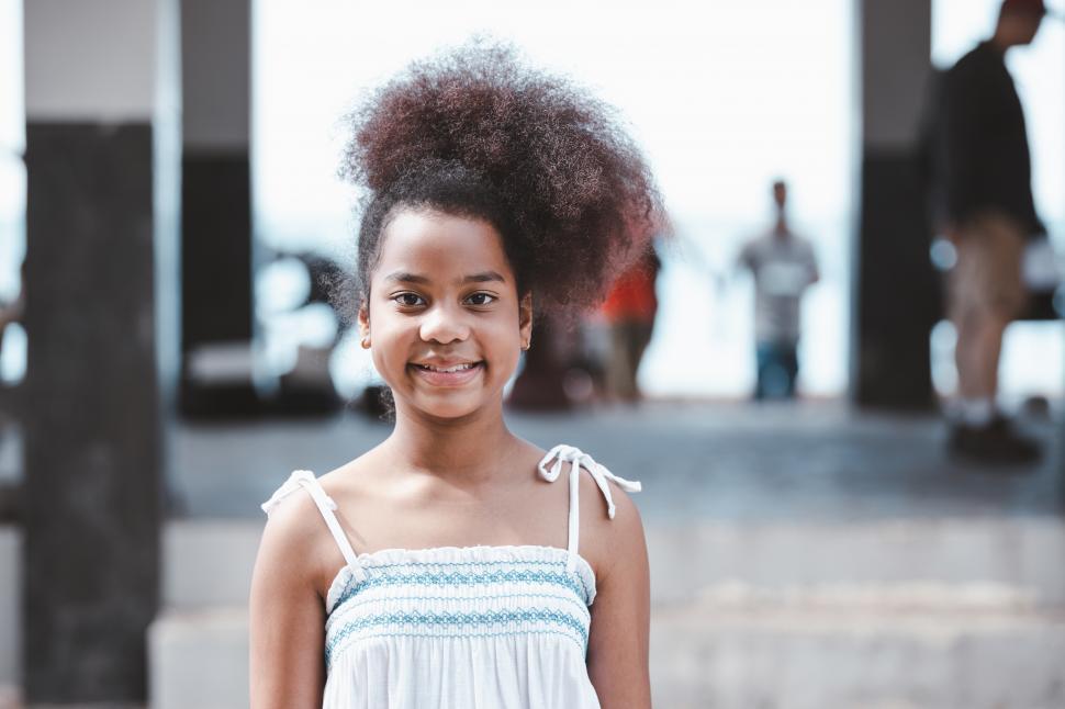 Free Image of portrait of young girl standing in outdoor park 