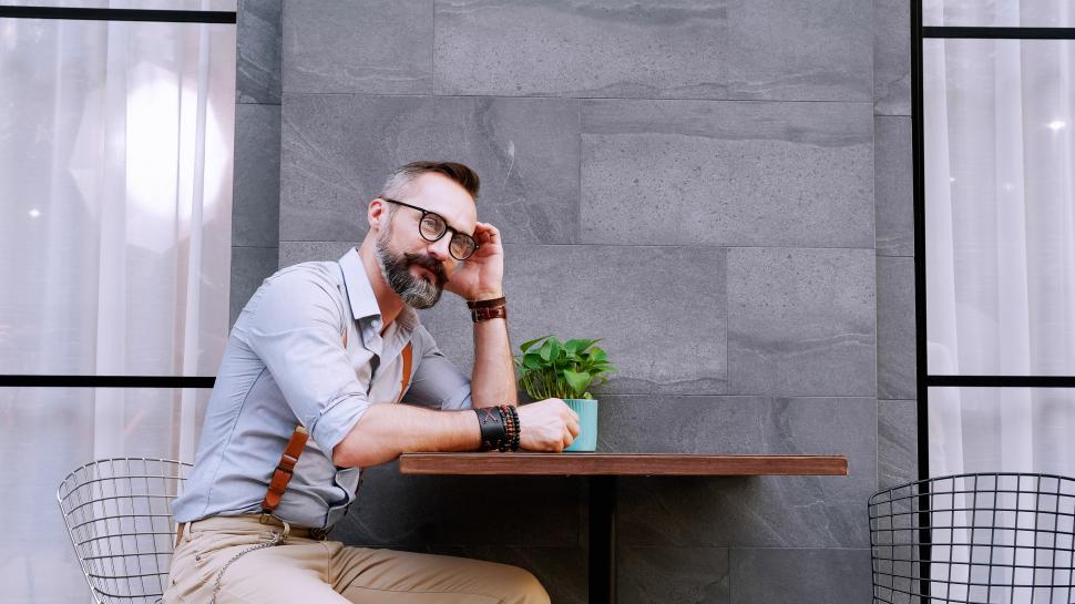 Free Image of Man sitting with a cup of coffee 
