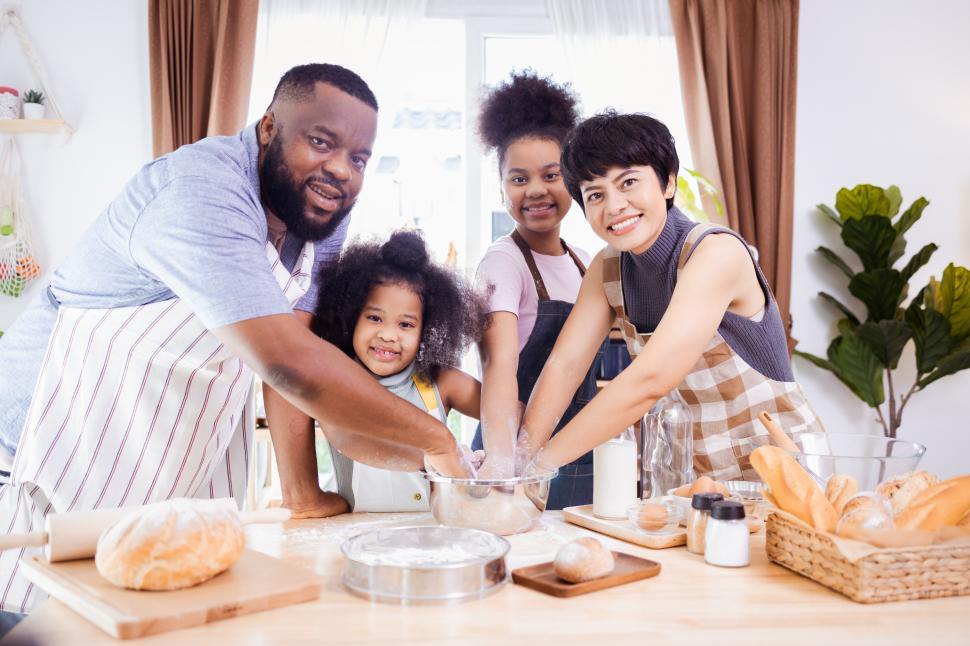 Free Image of Family with hands in the dough 