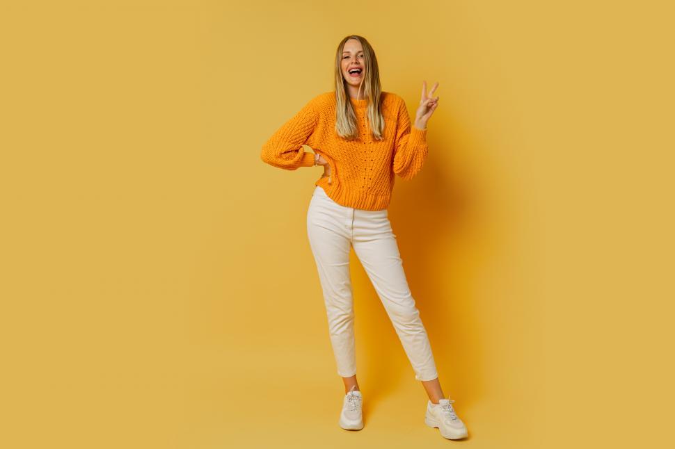 Free Image of Woman flashing peace sign 