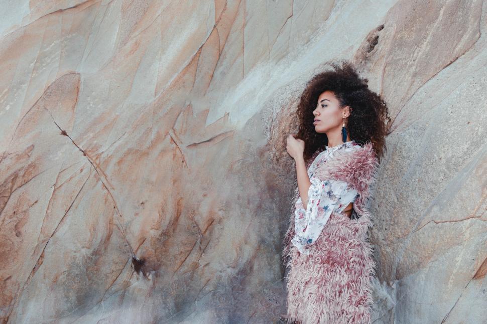 Free Image of girl against the rock wall 