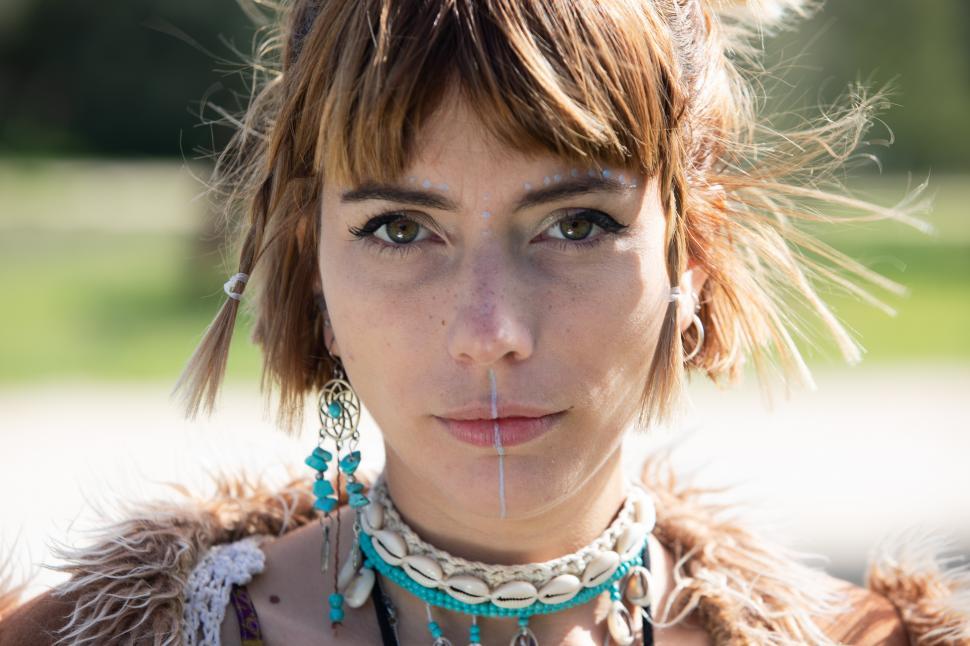 Free Image of a hipster woman posing outdoors natural background 