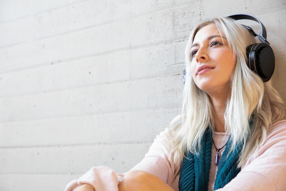 Free Image of a young woman enjoying music with headphones 