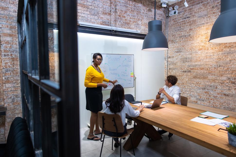 Free Image of Woman leading business presentation 
