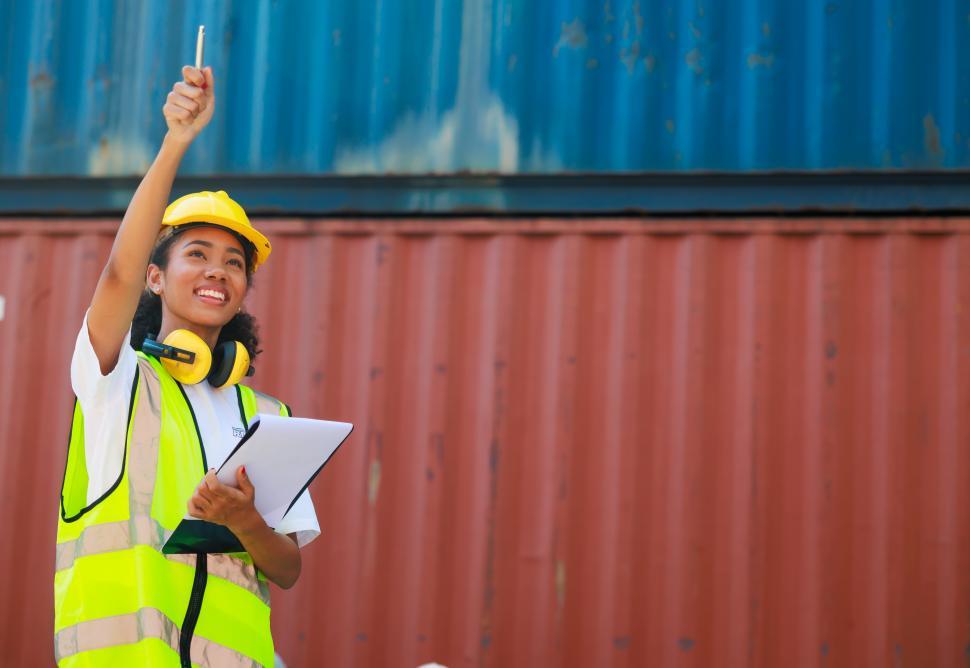 Free Stock Photo of Female dock worker control loading containers box