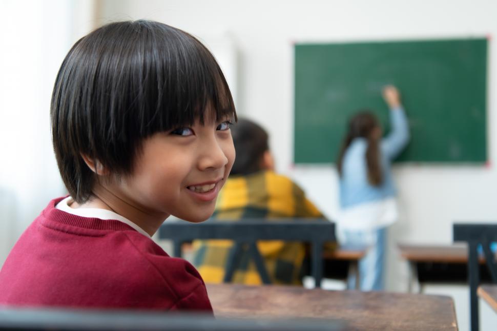 Student in a classroom looking at the back of the room