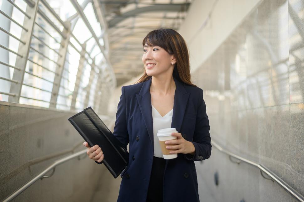Free Stock Photo of Young asian business woman is walking the corridor ...