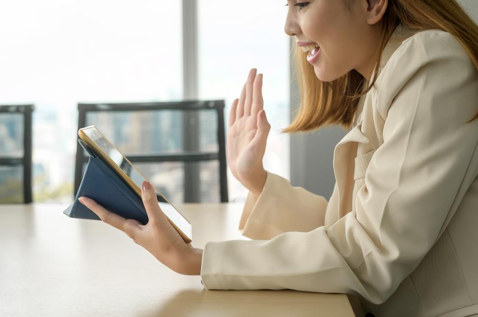Free Image of Young business Woman looking at screen while business meeting through video conferencing application in modern office 