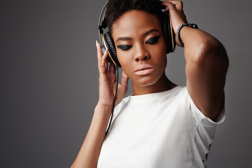 Free Stock Photo of rock style black woman with big earphones