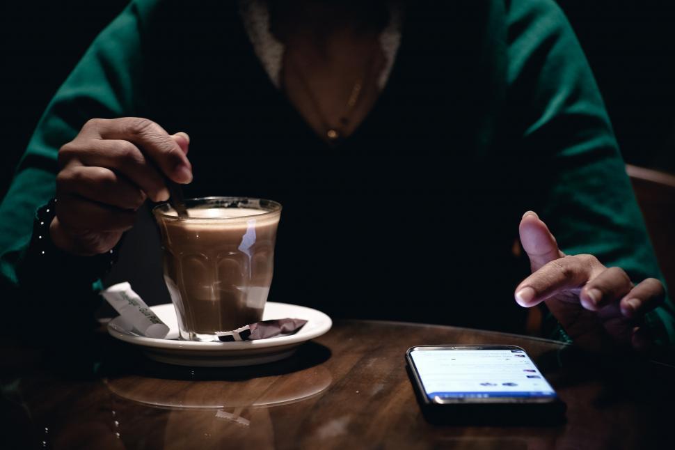 https://freerangestock.com/sample/151152/a-person-holding-a-spoon-in-a-glass-cup.jpg