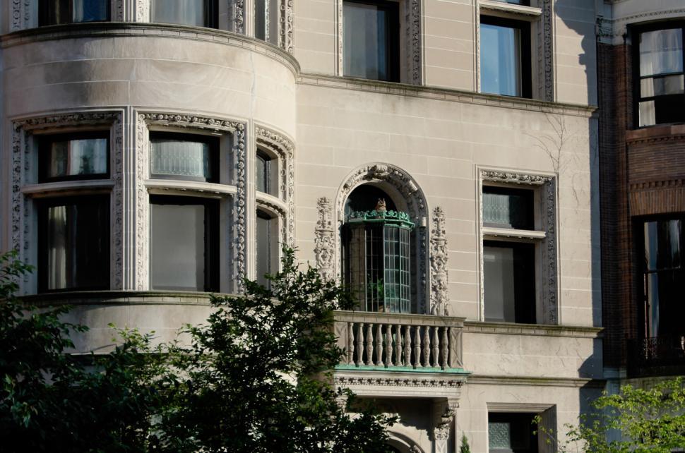 Free Image of Modern High-Rise Building With Numerous Windows and Balconies 