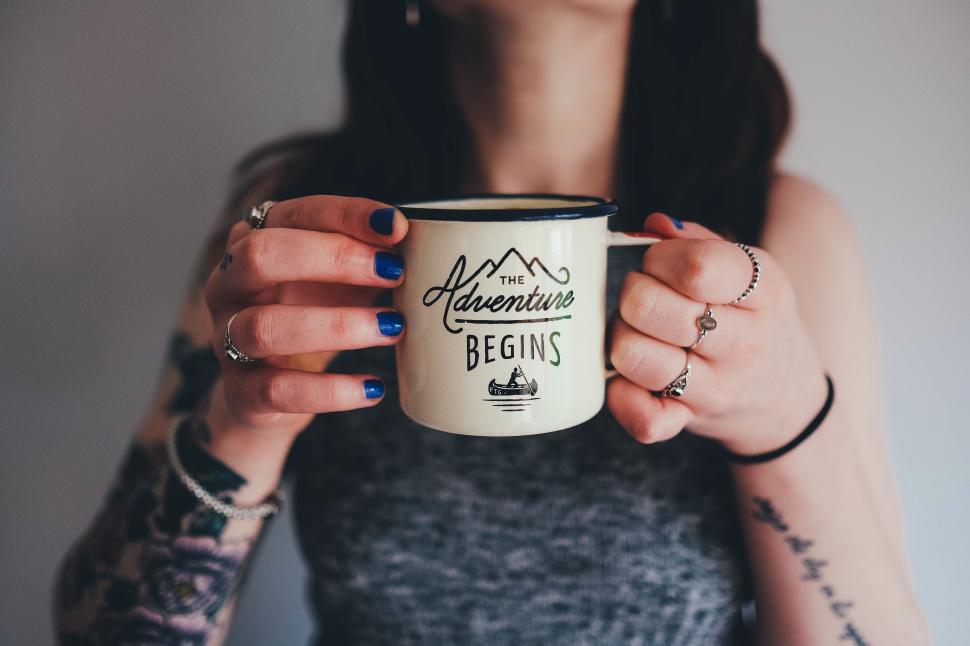 Free Image of A woman holding a mug 