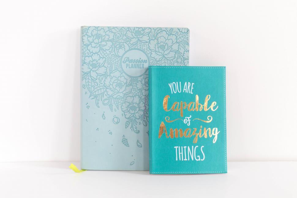 Free Image of A blue and gold notebooks 