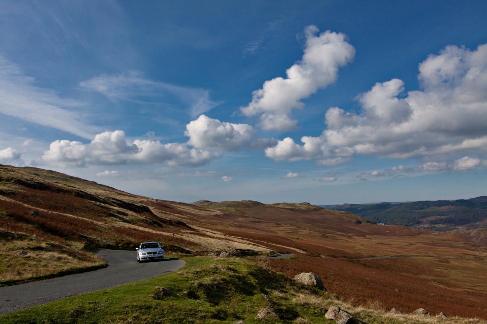 Free Image of A car on a road in a valley 