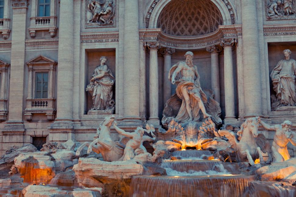Free Image of A statue of a man and a woman in front of a building 
