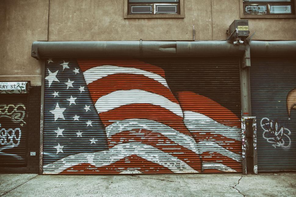 Free Stock Photo of A flag painted on a garage door Download Free