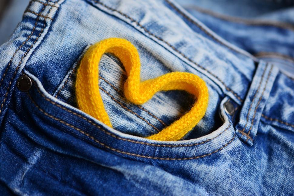 Free Stock Photo of A yellow rope in a pocket of jeans Download Free